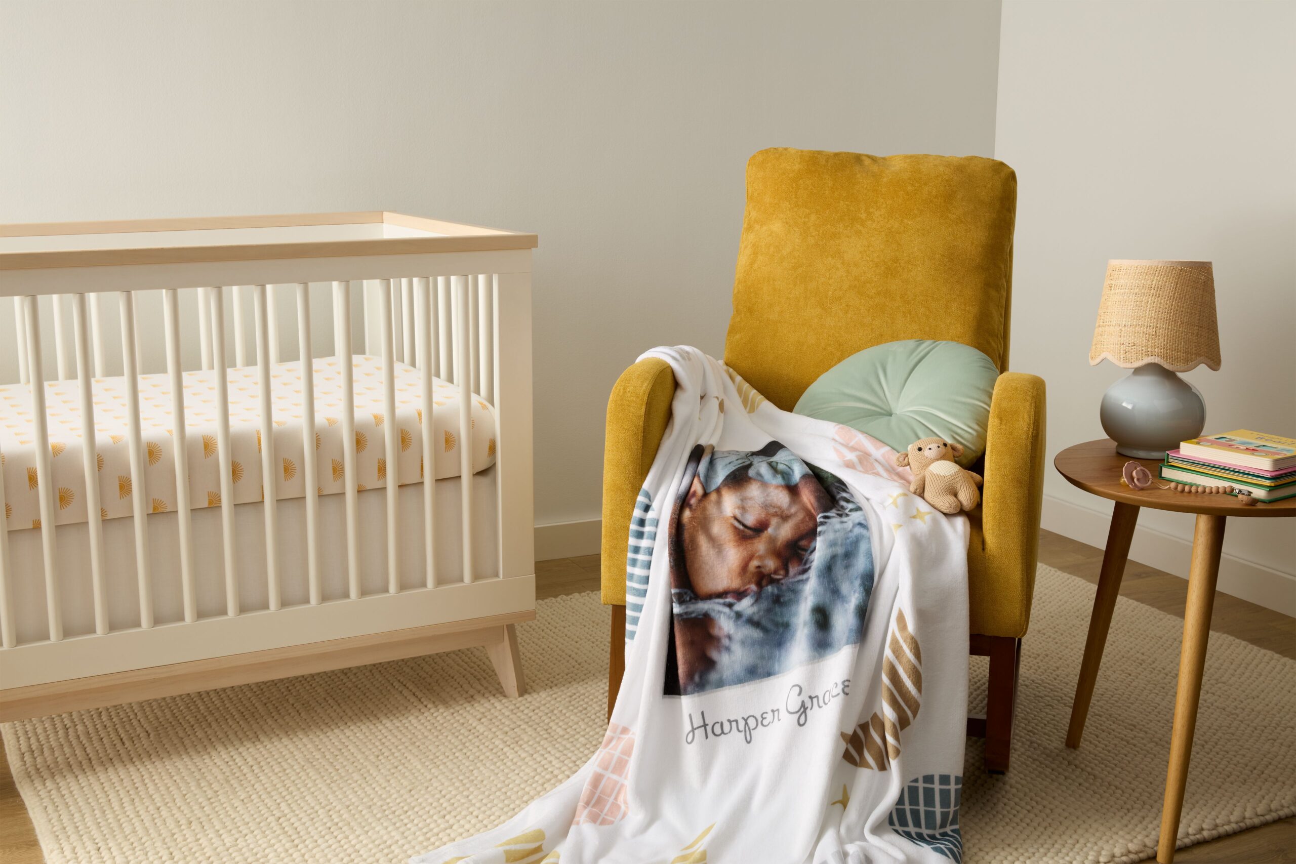 personalized blanket in nursery with picture of baby 
