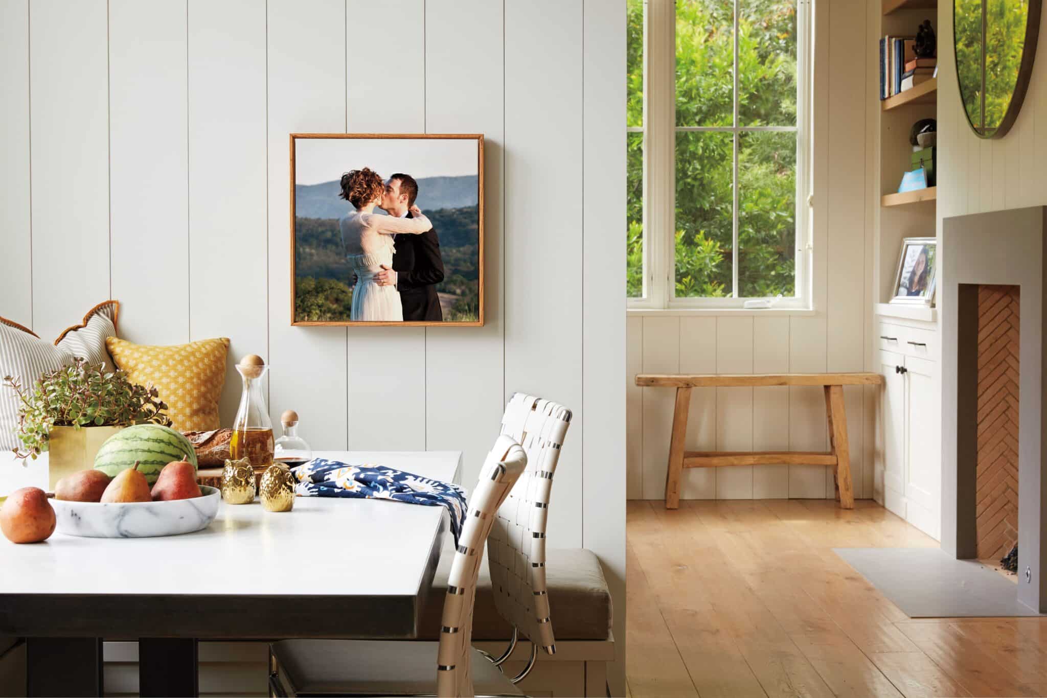 framed canvas print with wedding day picture hanging on wall