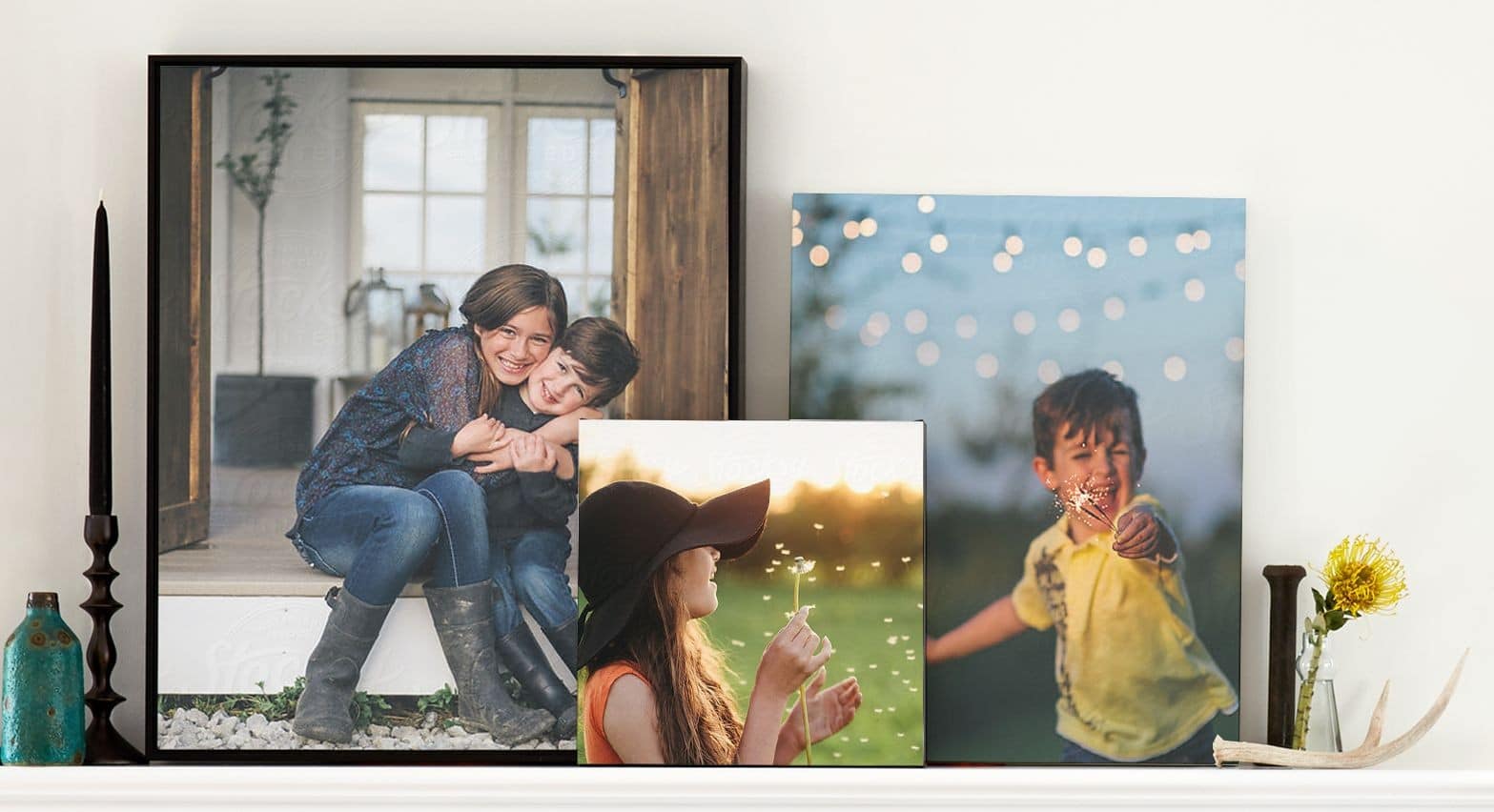 framed and unframed canvas prints on a shelf