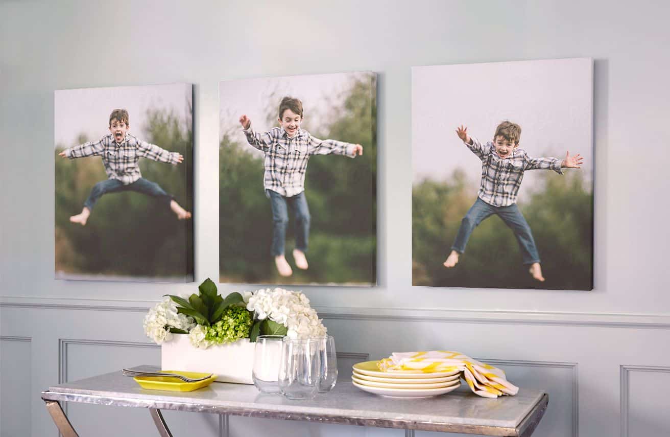 three canvas prints hanging on a wall with pictures of a young boy jumping